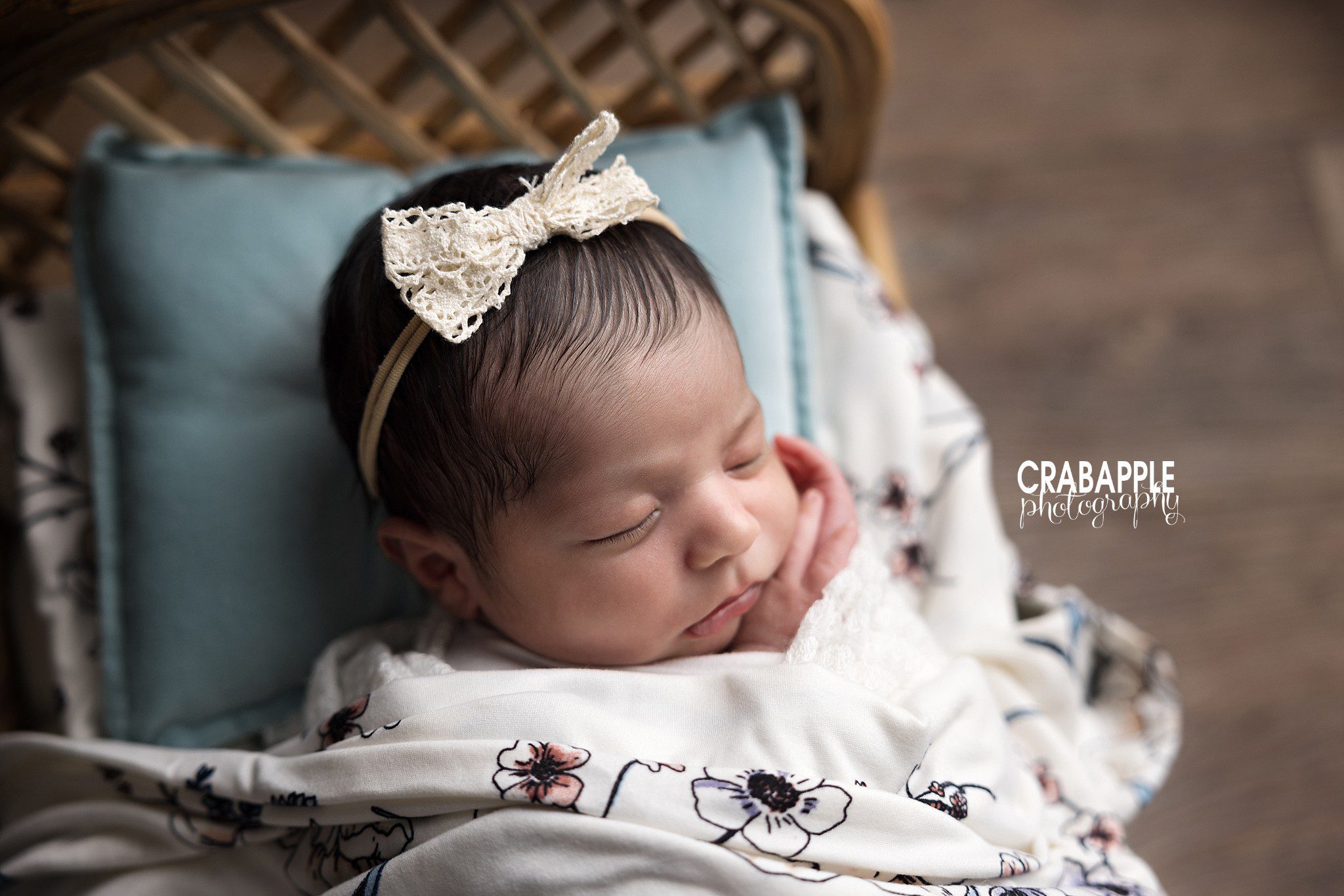 Floral Bed Close Up Close up newborn portrait on wooden bed with floral blanket