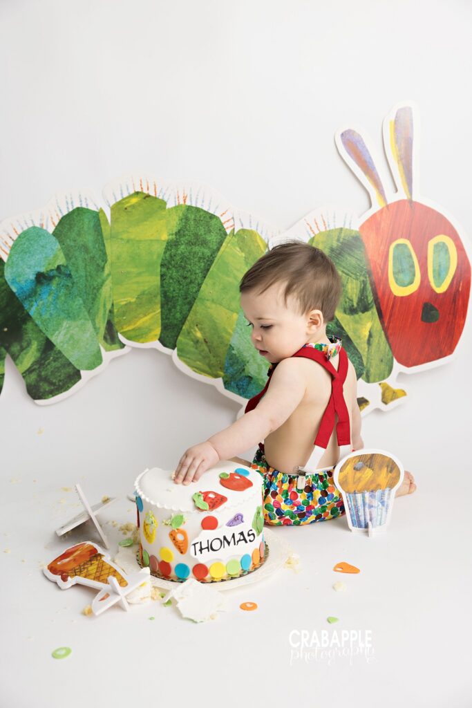 Custom Very Hungry Caterpillar birthday cake with colorful themed decorations
