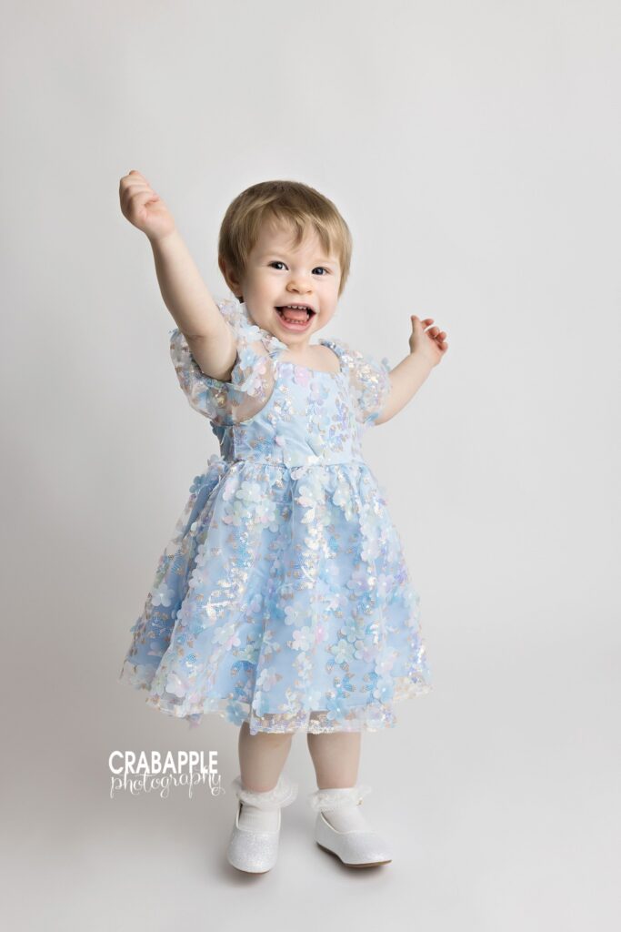 Laughing toddler girl photographed in Andover MA studio
