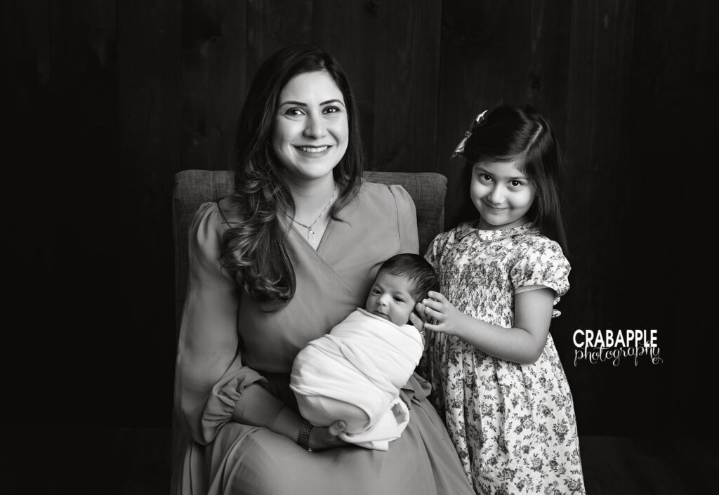 Mom and Sisters Portrait Black and white portrait of mother with newborn baby and older sister