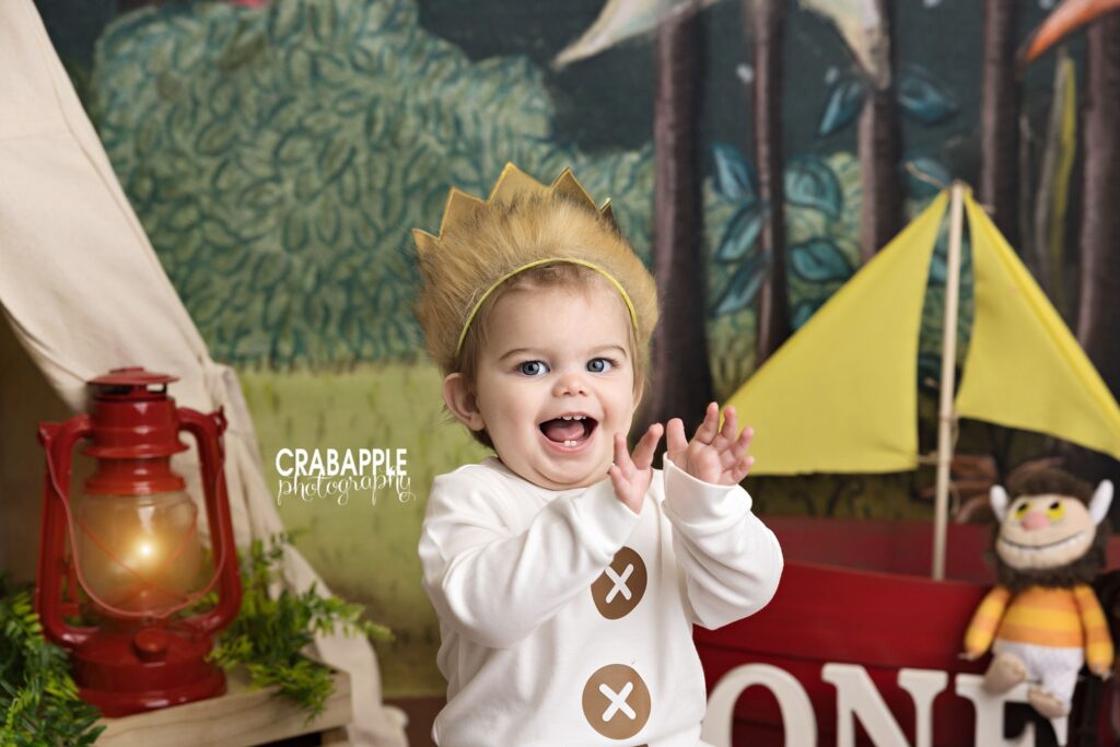 Happy boy dressed like Max during cake smash session book inspired