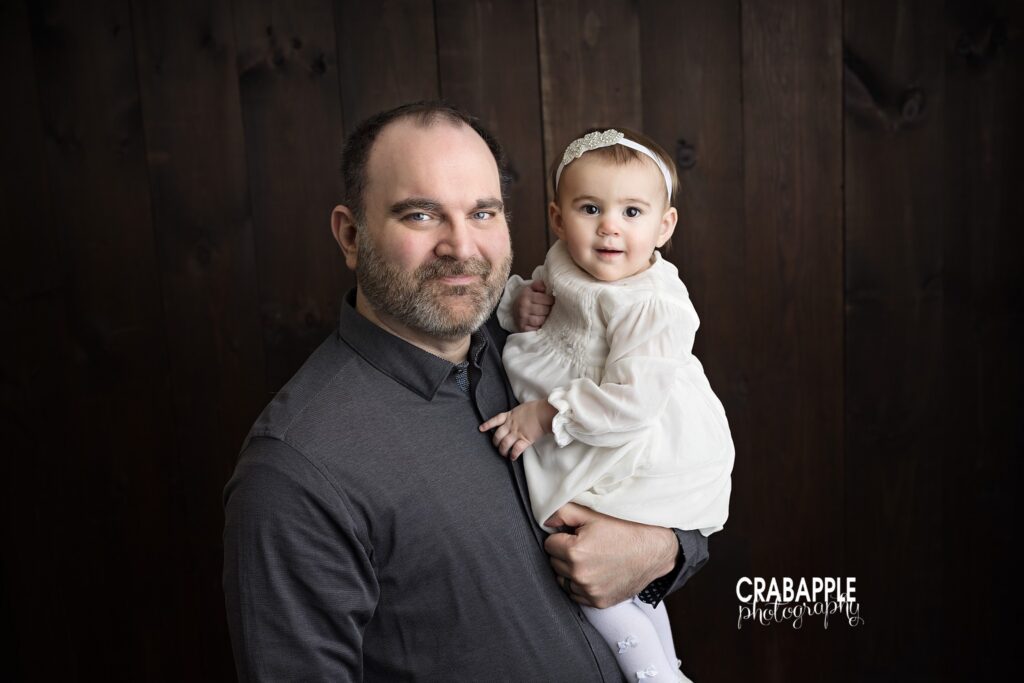 Father and Daughter Father holding his daughter during first birthday photography session