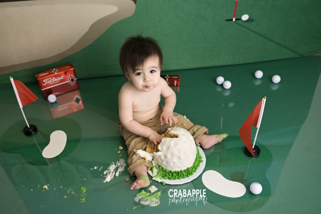 Golf themed cake smash session featuring sporty first birthday setup photographed in Andover MA studio