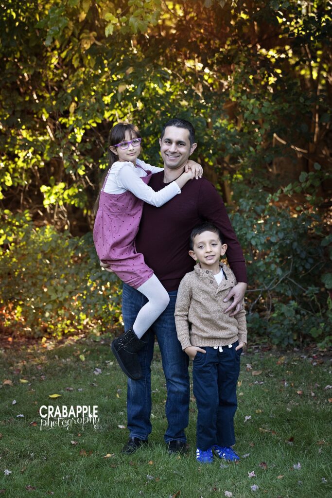 Dad and children fall family photos Dad with both children during an outdoor fall family session in Medford MA