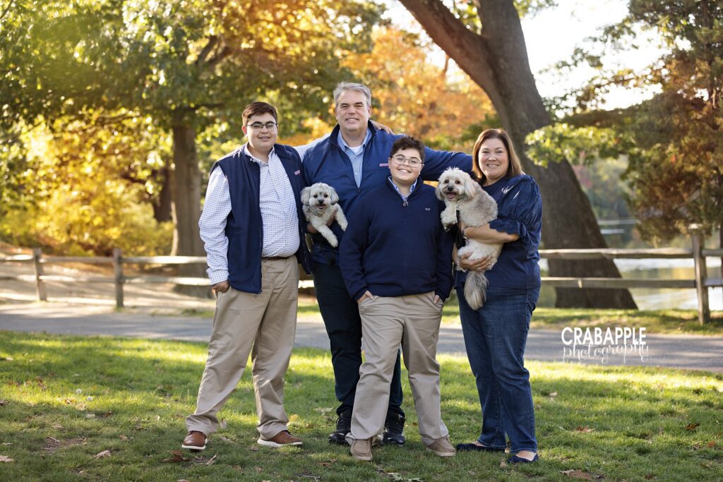 Fall family photos in Medford MA Family posing together for outdoor fall family photos in Medford MA