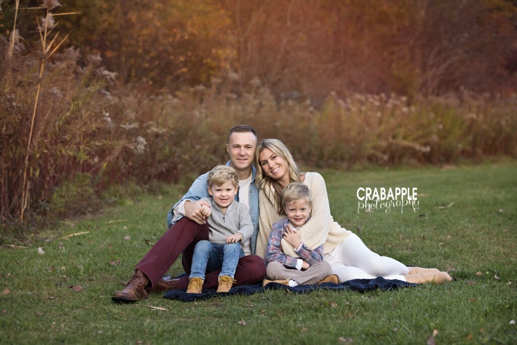 Fall family portrait at Ipswich River Park Family portrait surrounded by fall foliage at Ipswich River Park in North Reading MA