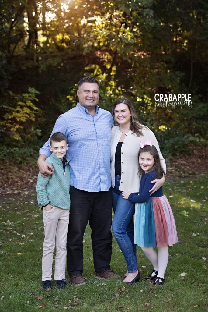 Fall family portrait in Medford Family portrait surrounded by autumn foliage during a fall session in Medford Massachusetts