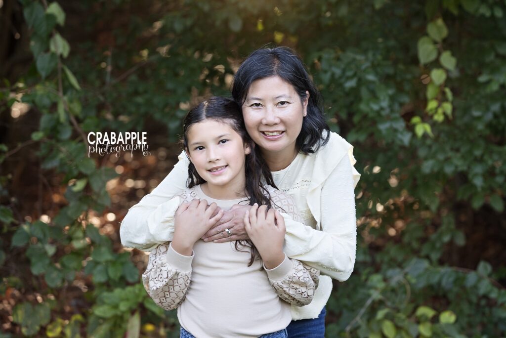 Mom and child fall photos in Medford Mom and child sharing a moment during fall family photos in Medford MA