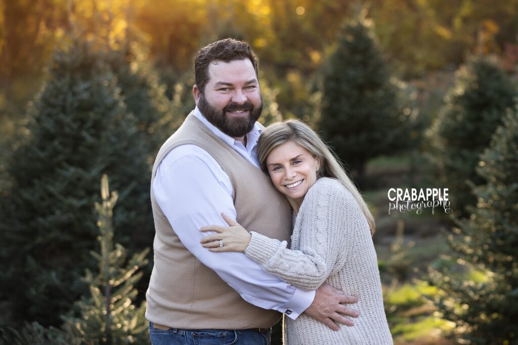 Mom and dad portrait Mom and dad embracing during their fall family photo session at the tree farm