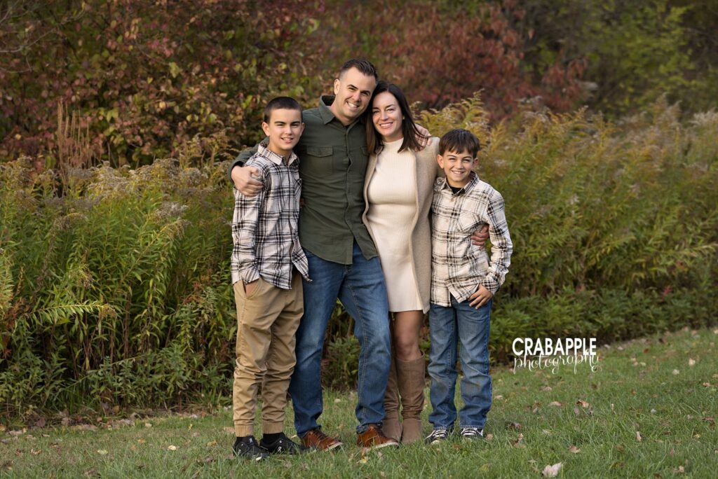Ipswich River Park fall family session Family together during a fall family photography session at Ipswich River Park in North Reading MA
