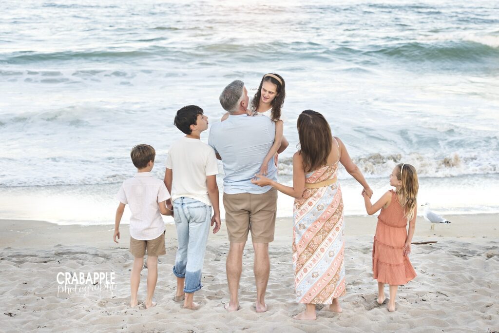 Winchester family walking toward the ocean together at Salisbury Beach
