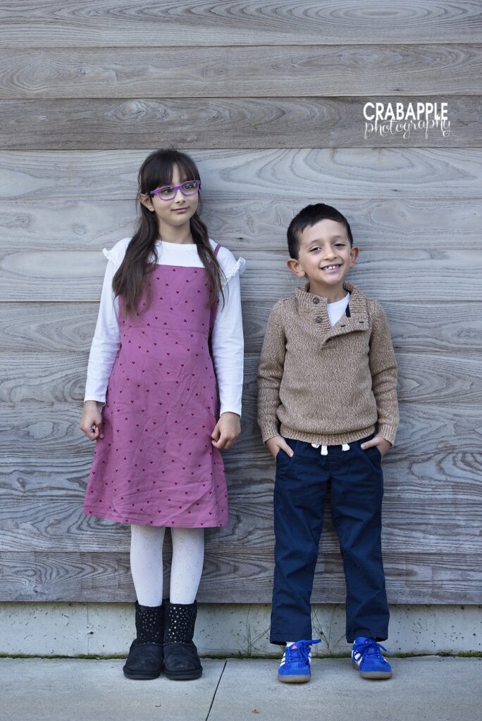 Sibling fall family photos in Medford Siblings enjoying a relaxed fall family photography session in Medford
