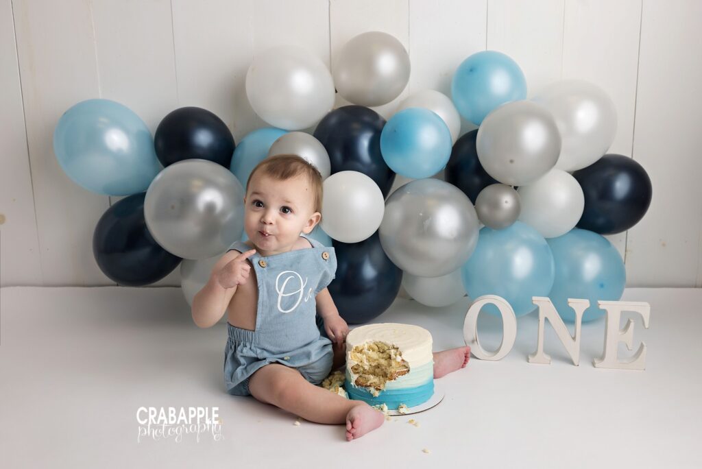 Baby boy enjoying his birthday cake Baby boy enjoying his birthday cake during his 1-year photography session