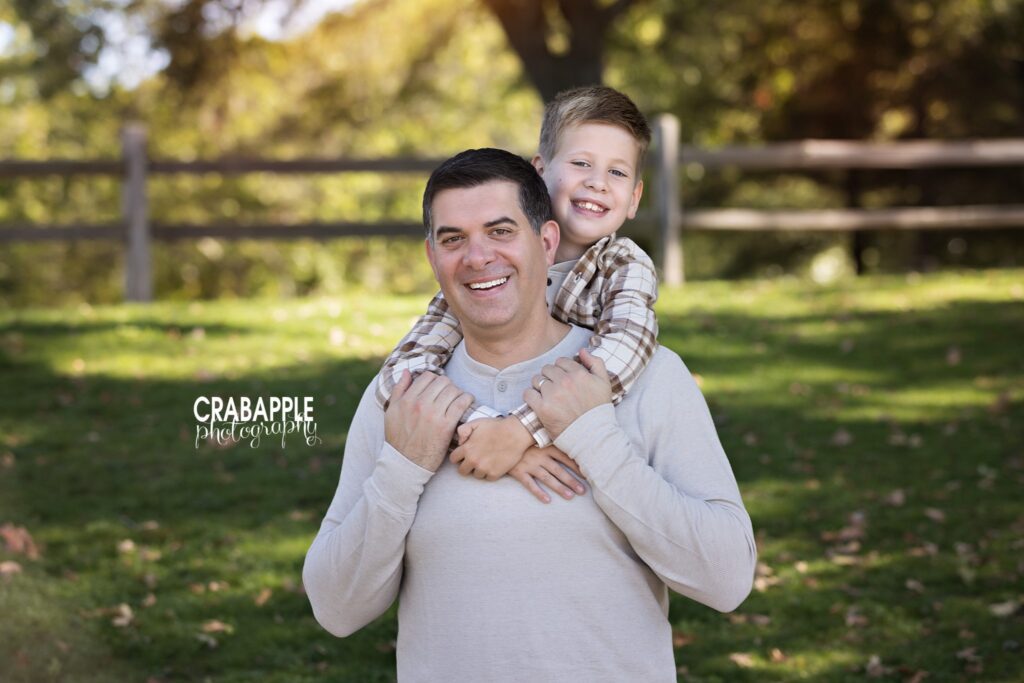 Father holding his son during an outdoor fall family photo session
