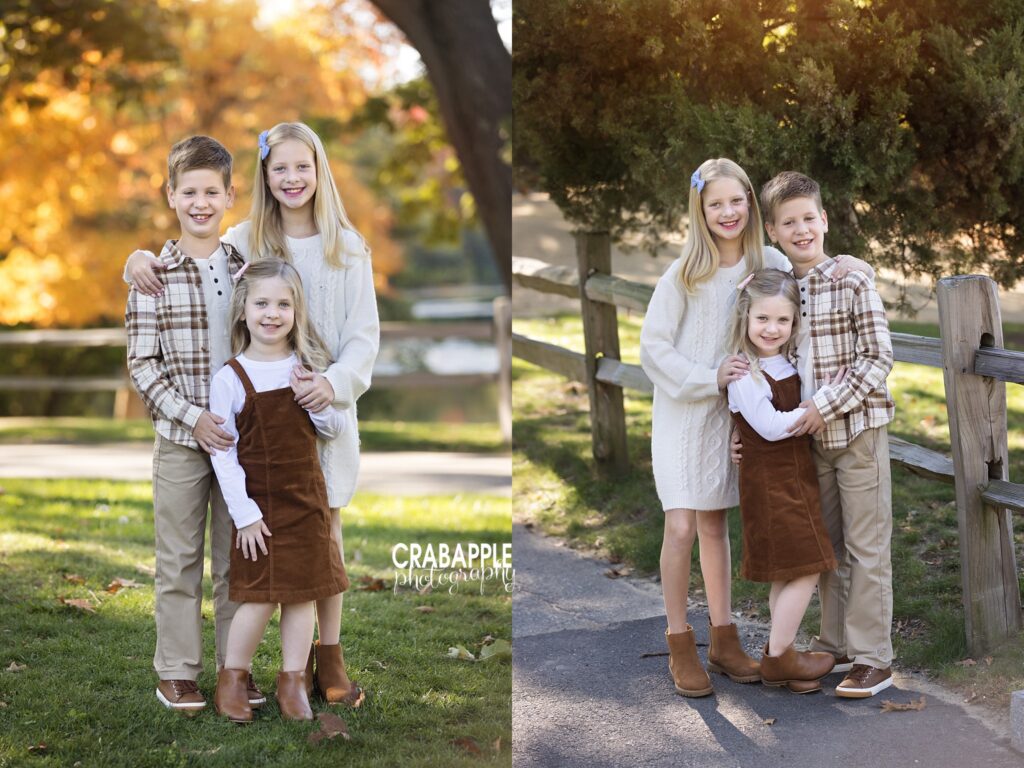 Three children posing together during an outdoor fall family photo session
