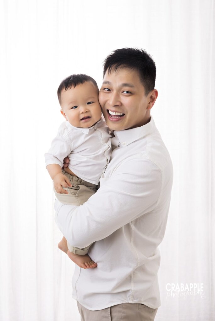 Dad and son share a cuddle during Andover MA baby milestone photo session