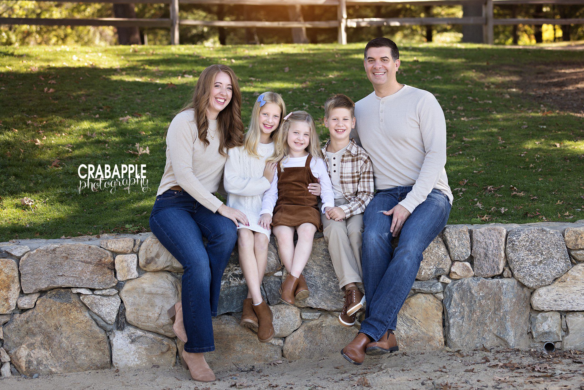 Family of five wears coordinating outfits for fall outdoor photos