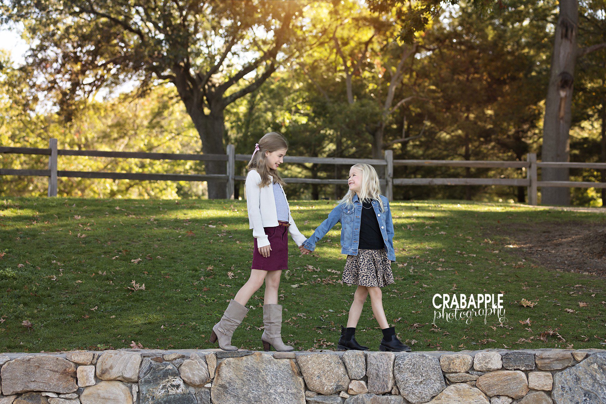 Two sisters wear fun outfits for their fall family photos