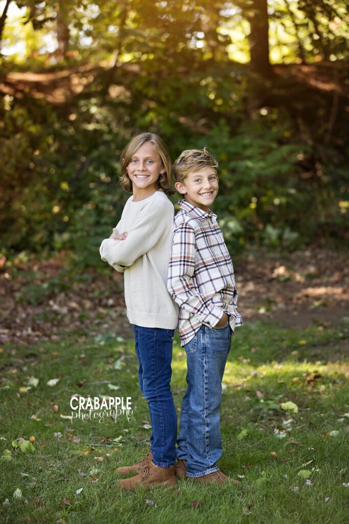 Brothers back to back Two brothers standing back to back during Medford MA fall family photos