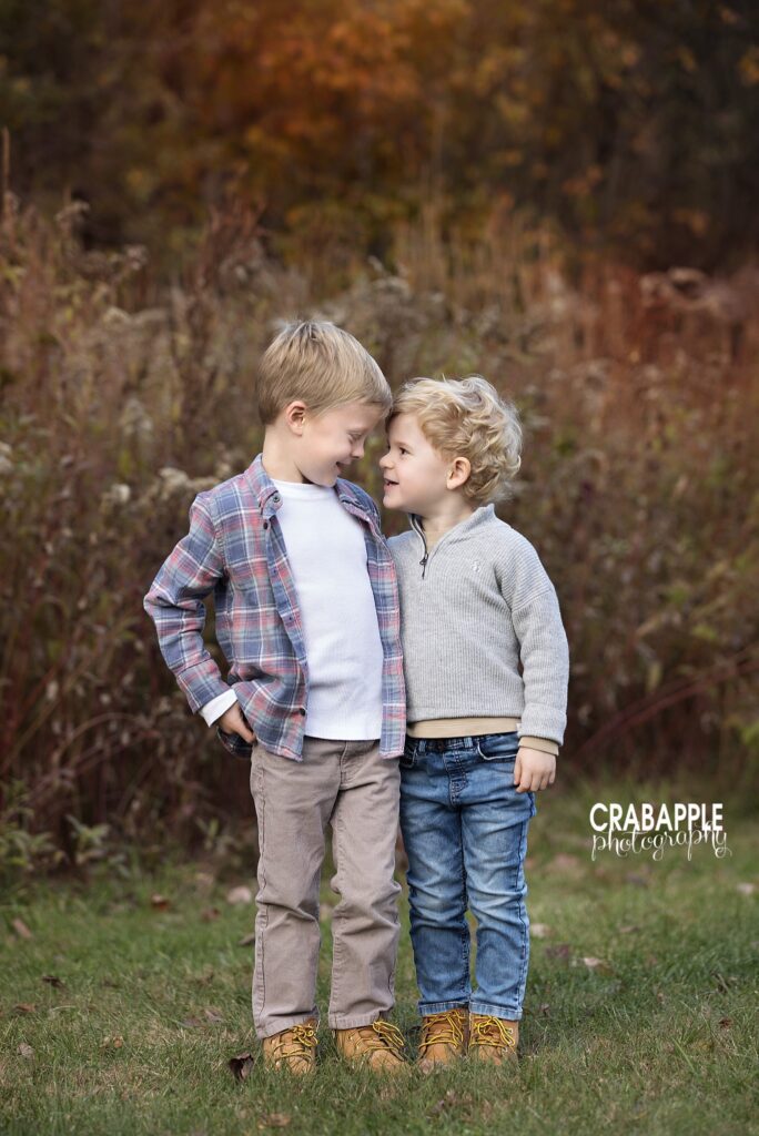 Natural fall portrait of brothers Two brothers looking at each other during a natural fall portrait at Ipswich River Park