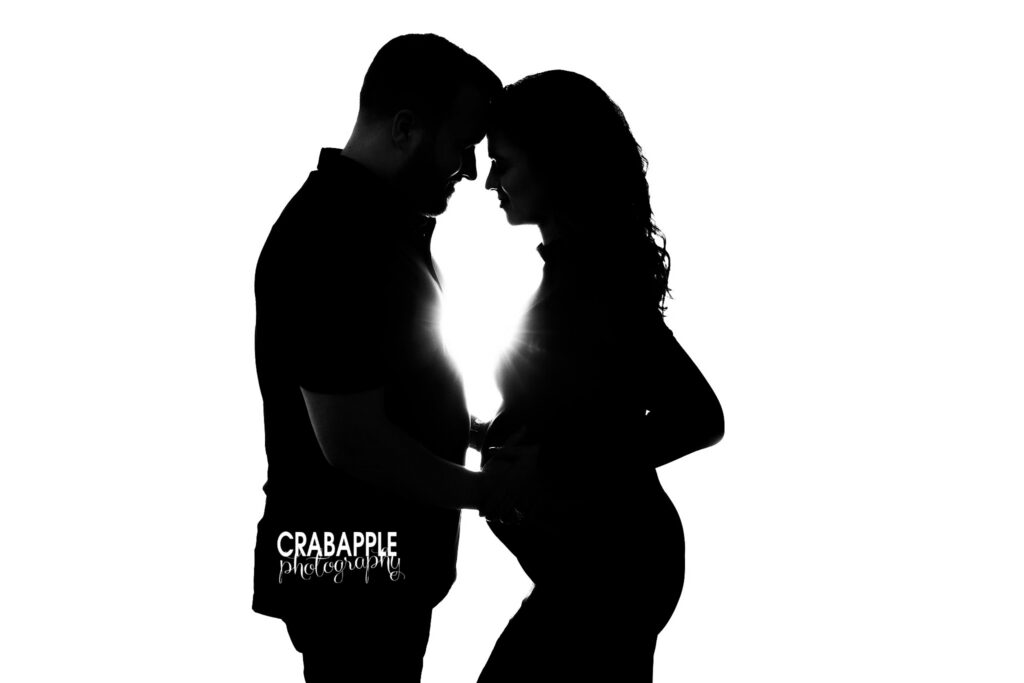 Maternity couple silhouette Romantic silhouette portrait of an expecting couple during an in-studio maternity session
